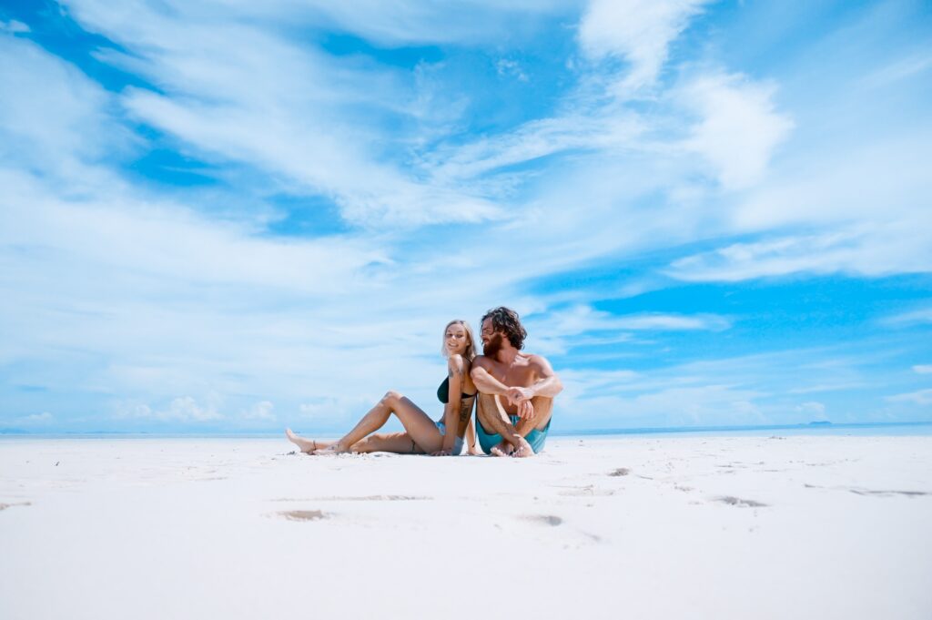 picture of couple on beach enjoying a holiday and travel